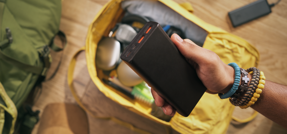 image of a person holding a battery
