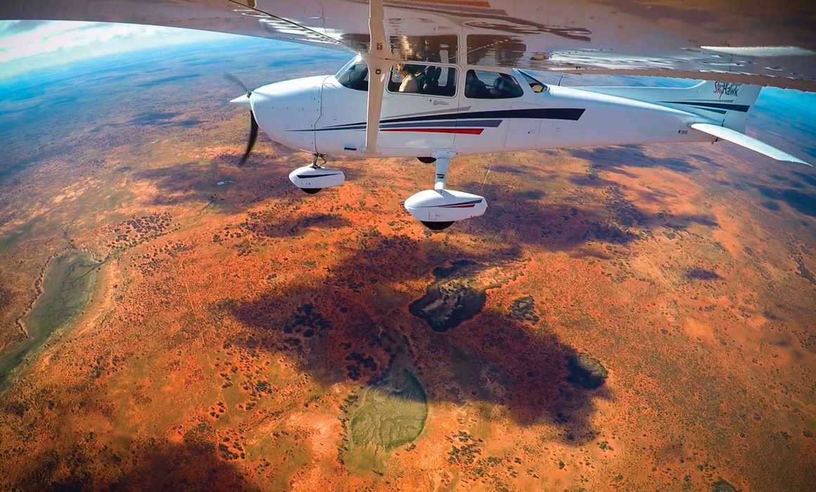 A Cessna 172S flying over a outback Queenland