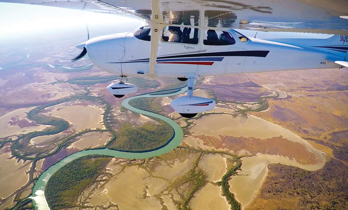 A plane flying up in the sky
