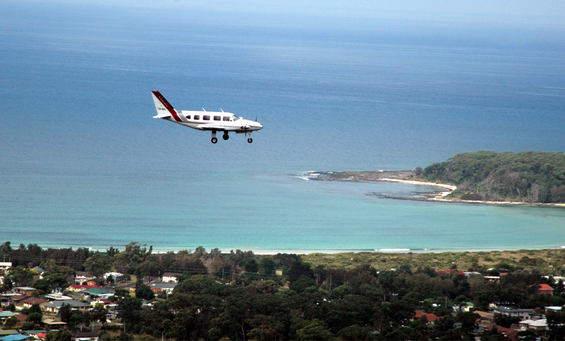 Brindabella Airlines Piper PA-31 Navajo flying over the NSW south coast on the approach to Moruya Airport.