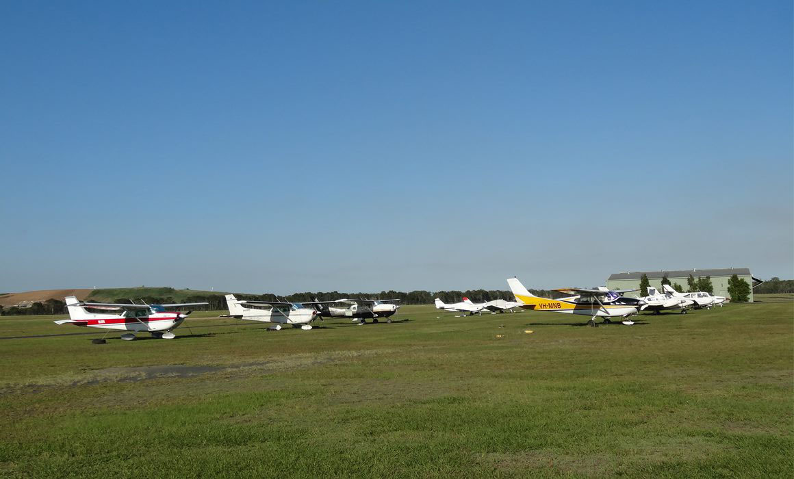Planes parked on grass at Caboolture Airport