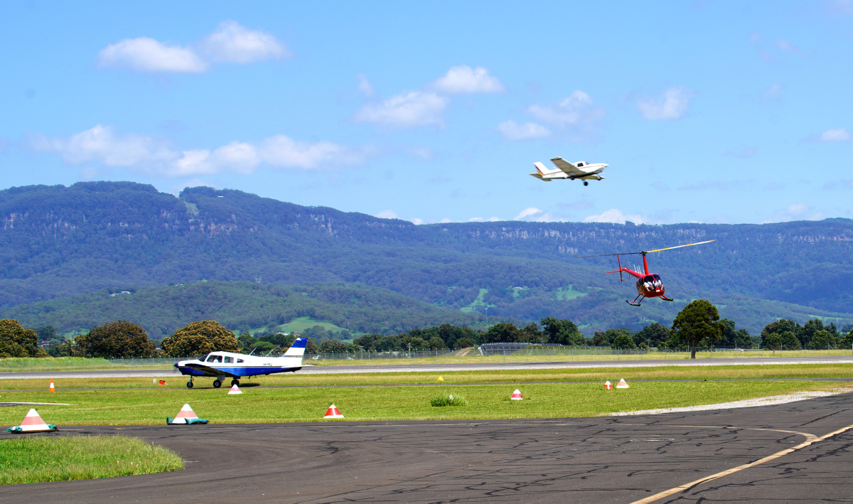 Fixed wing and helicopter at airport