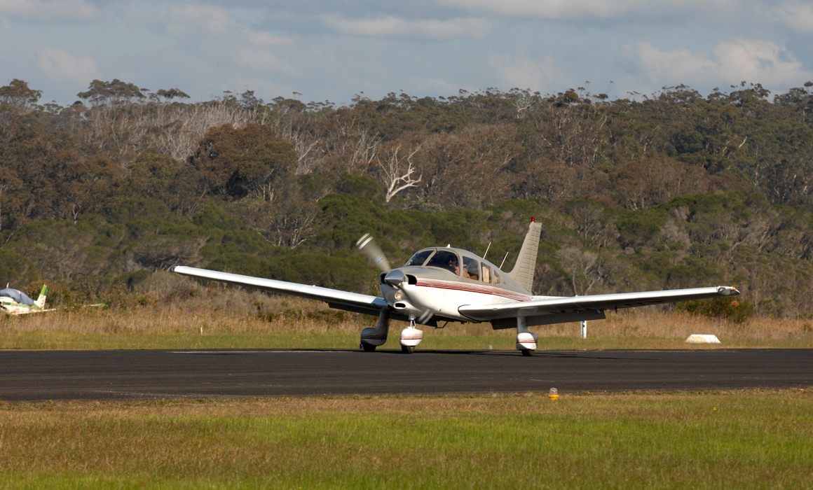 Piper PA-28-236 Dakota taking off at Merimbula Airport.