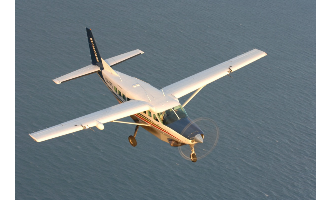 Cessna aircraft flying over water