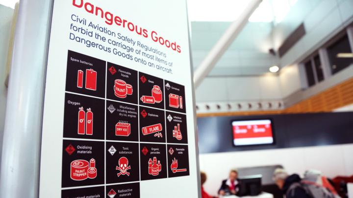Dangerous goods poster at an airport