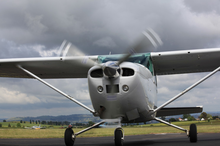 A plane preparing to take off on a cloudy day