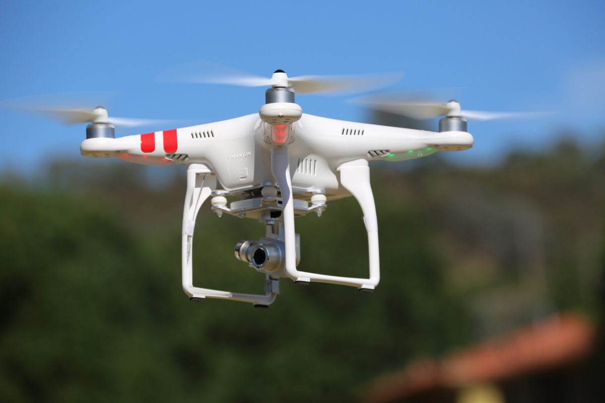 A flying quadcopter drone
