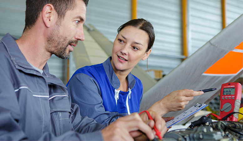 A male and female maintenance engineer working together