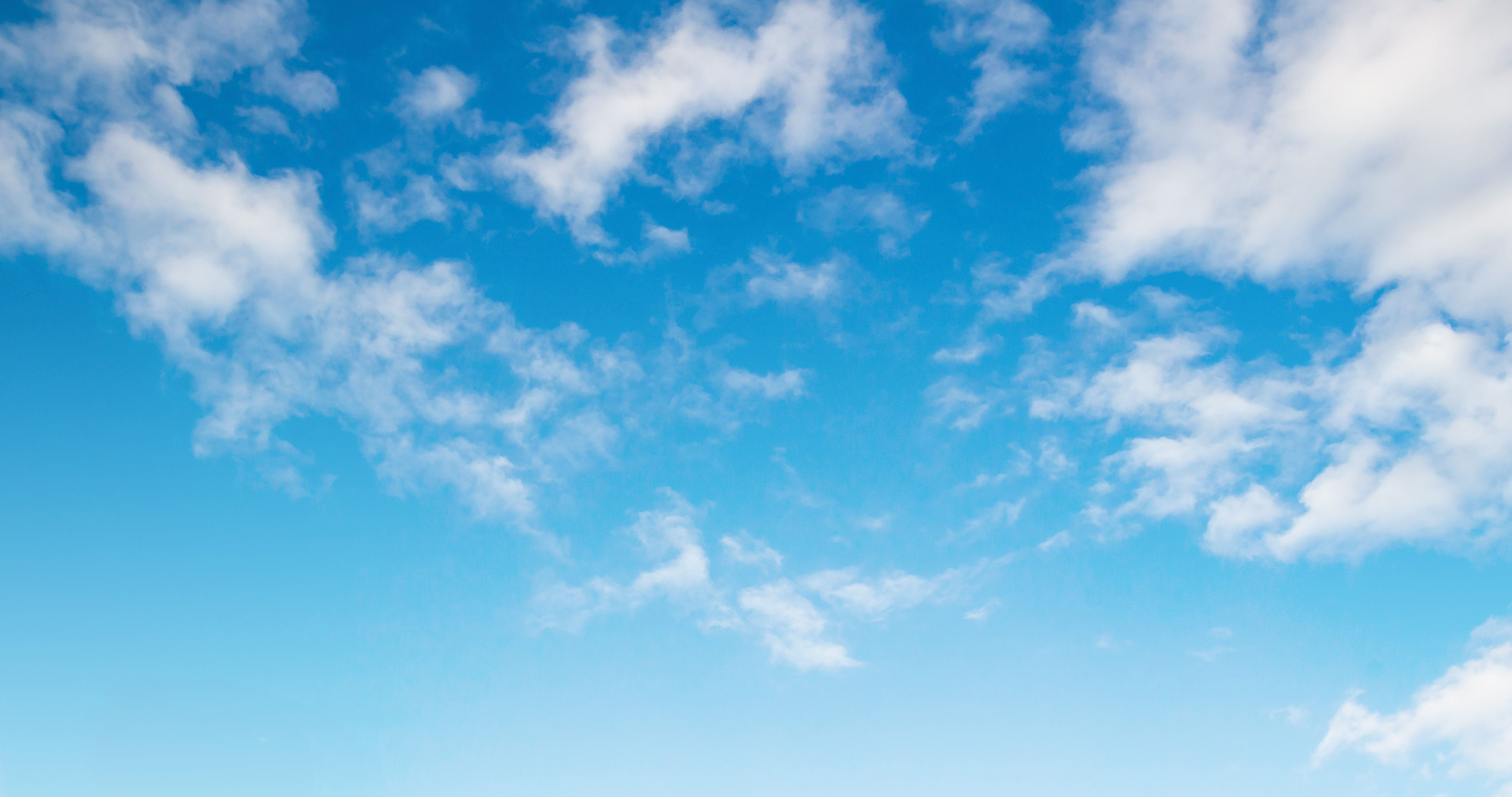 Fluffy white clouds on a blue sky