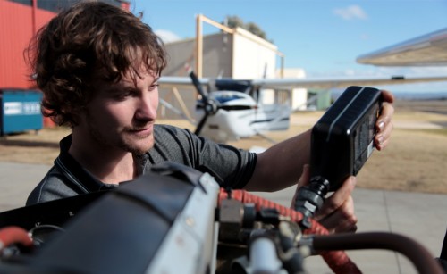 Maintenance engineer changing oil