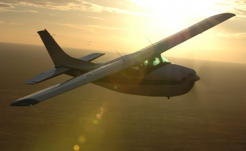 A plane flying up in the sky