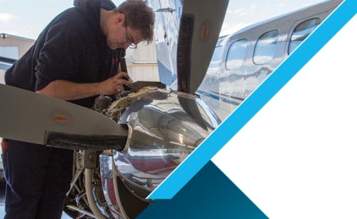 Person working on plane engine