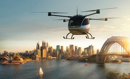An AAM vehicle flying over Sydney Harbour