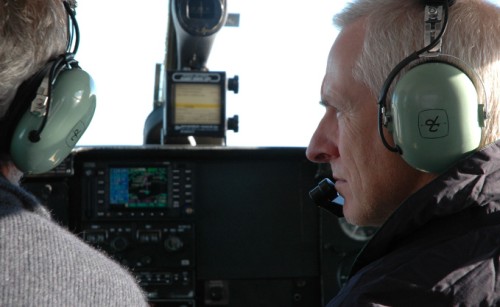 A pilot of an aircraft looking at the pilot on his left