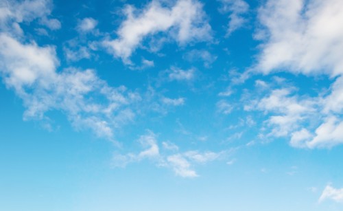 Fluffy white clouds on a blue sky