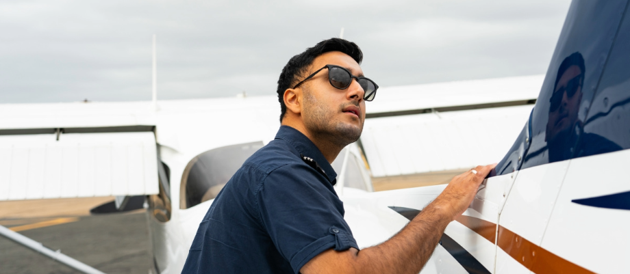 Image of a pilot looking upwards towards the sky