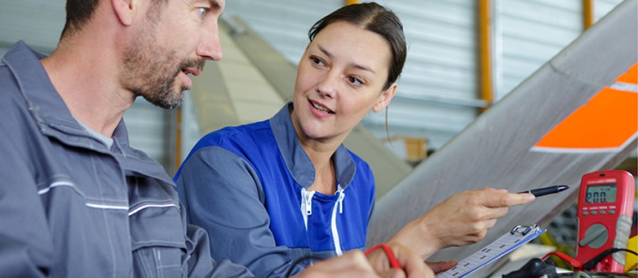 A male and female maintenance engineer working together