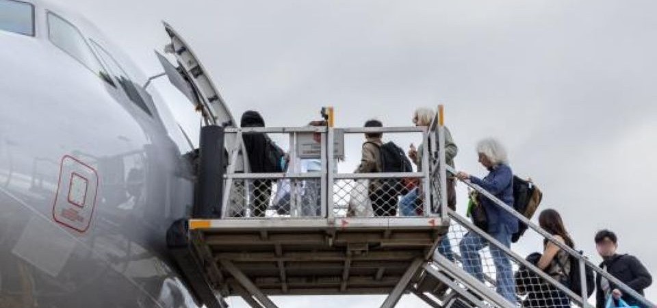 passengers across on a flight at Melbourne airport