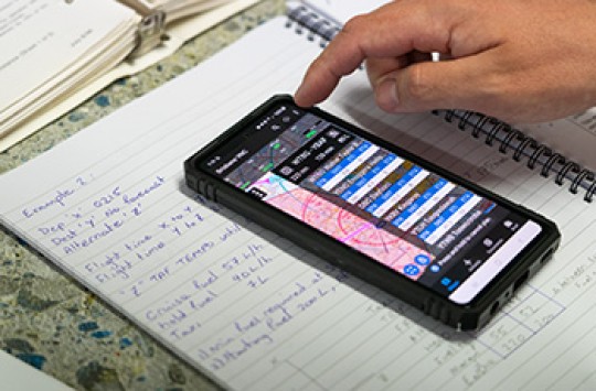 A phone being used to help with flight planning