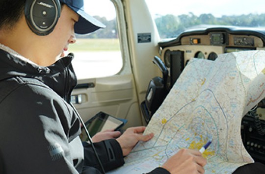 A pilot doing preflight planning