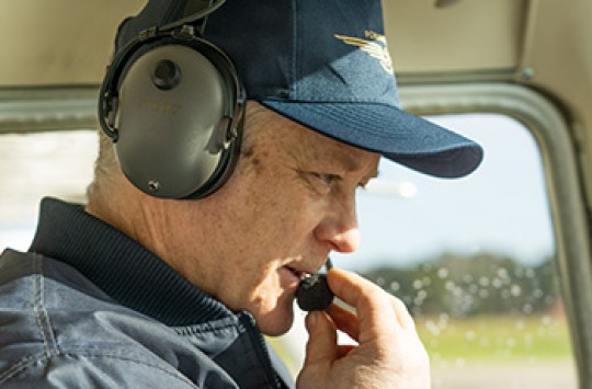 A pilot talking on the radio