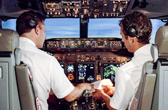Two pilots in a commercial jet's cockpit