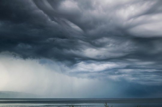 The sky darkened by heavy clouds