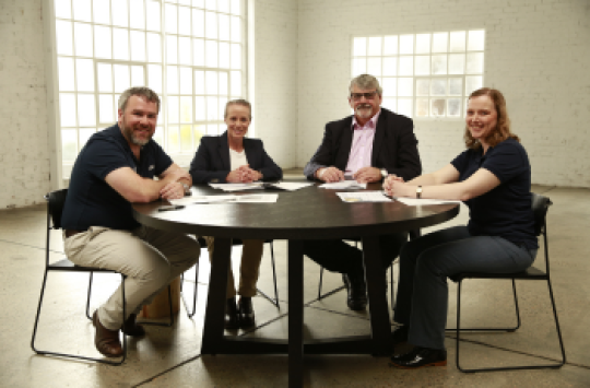 A group of aviation experts sitting around a table