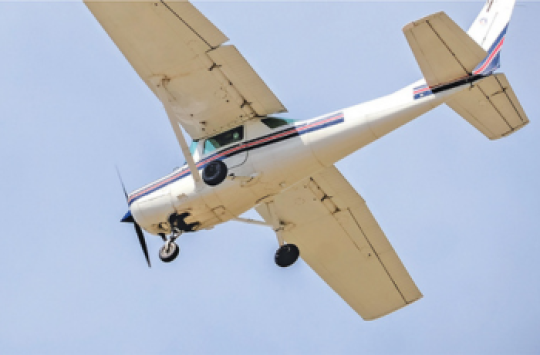 A plane flying through the air