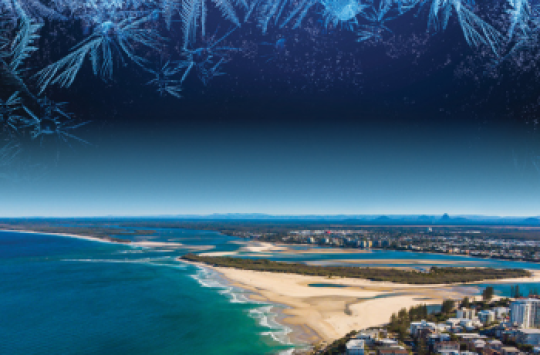 A beach with an image of frost overlaying the sky