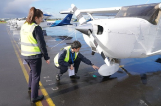 Officials inspecting an aircraft