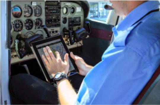 Pilot holding an electronic device