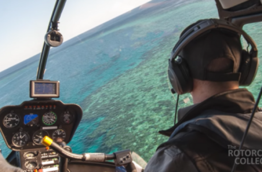 Image of a pilot flying a helicopter