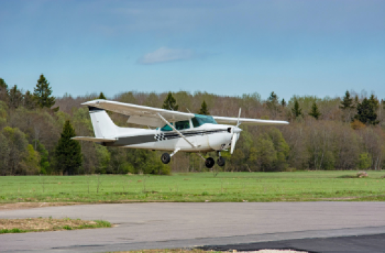 An aeroplane coming down to land on a runway