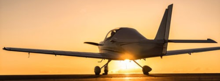Aircraft taxing with the sunset in the backgrond
