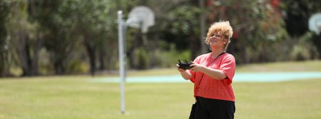 a lady is flying a drone