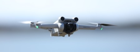 White drone flying