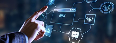 A hand reaching out towards a box labelled "risk" floating in mid-air, with a bunch of symbols floating around it