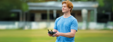 A man flying a drone