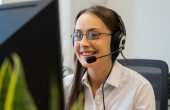 Person with a headset on at a desktop PC
