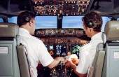 Two pilots flying a plane together