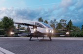 An advanced aerial mobility "flying car" parked on pavement