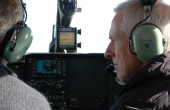 A pilot of an aircraft looking at the pilot on his left