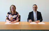 Pip Spence, CASA CEO and Director of Aviation Safety, and Enrico Palermo, Head of the Australian Space Agency, smile as they sign the Memorandum of Understanding