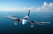 A Beechcraft twin-engine aeroplane flying through the sky