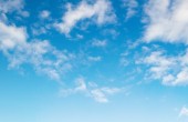 Fluffy white clouds on a blue sky