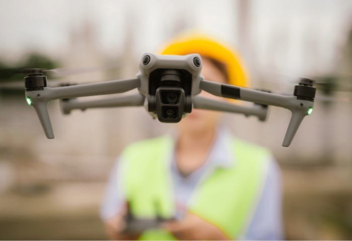 A drone hovering in front of the person flying it