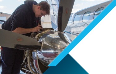Person working on plane engine