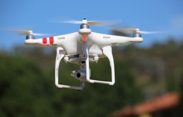 A flying quadcopter drone
