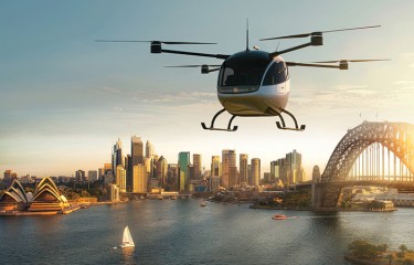 An AAM vehicle flying over Sydney Harbour